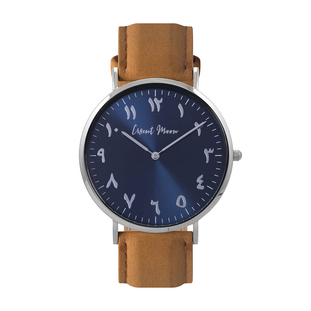 Arabic Numeral Watch with Tan Leather Strap, Silver Case, and Blue Dial by Crscnt Moon. Front Facing Photo.