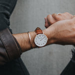 Man Wearing Arabic Numerals Watch with Brown Leather Strap and Rose Gold Case by Crscnt Moon
