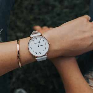
            
                Load image into Gallery viewer, Woman Wearing Arabic Numerals Watch with White Leather Strap and Rose Gold Case by Crscnt Moon
            
        